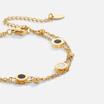 Carla – Delicate gold bracelet with contrasting round elements