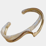 Elegant gold bracelet with white opal